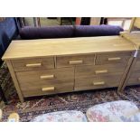 A modern contemporary oak seven-drawer chest, width 150cm, depth 45cm, height 71cm