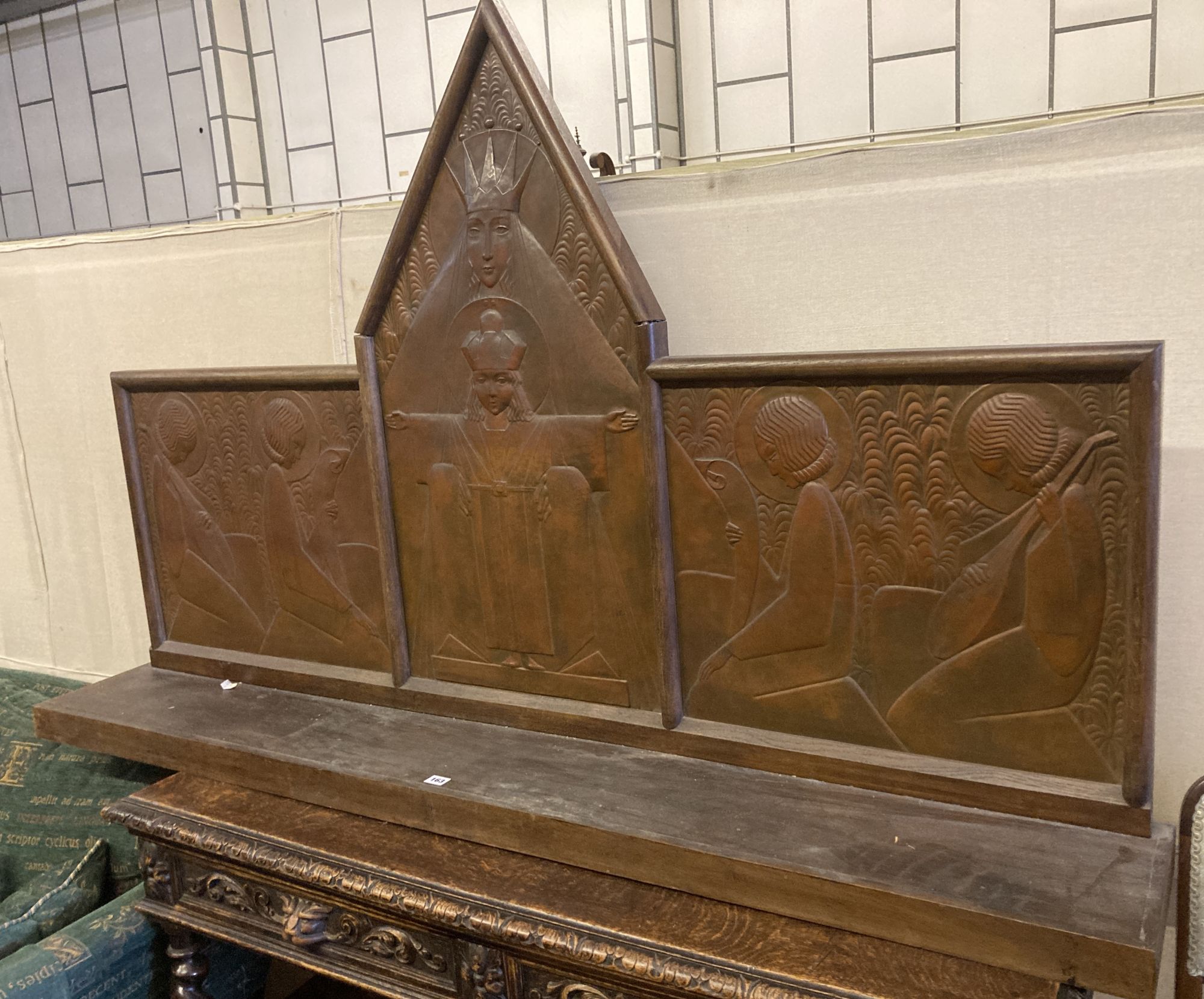 An Arts & Crafts oak and embossed copper triptych by Felix Jacques, signed and dated 1928, width