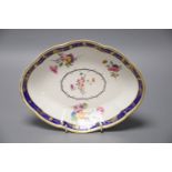 A Chelsea Derby oval dish painted with flowers in the manner of Withers under a Smith's blue and