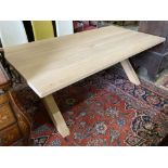 A contemporary oak X-framed dining table, length 200cm, depth 100cm, height 76cm