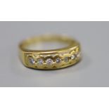 A modern 18ct gold and seven stone diamond set half eternity ring, size O, gross 4.1 grams.