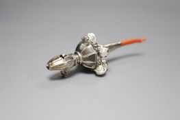 A George V silver child's rattle with coral teether and six bells, Crisford & Norris, Birmingham,