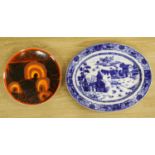 A Poole pottery charger and a blue and white oval Ashworth dish, length 55cm