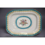 A Worcester canted platter or serving dish painted with flowers within a gilt and turquoise sawtooth