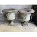 A near pair of reconstituted stone campana garden urns, larger 66cm diameter, height 85cm