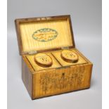 A George III harewood and marquetry tea caddy, c.1810, the fitted canisters labelled 'G' and 'B' for