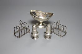 A small George III silver basket, London, 1785, a pair of Victorian silver peppers and a pair of