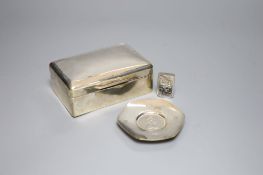 A silver cigarette box (marks rubbed), 14cm, a modern silver commemorative dish and a silver vesta