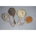 Four assorted hand mirrors including two silver and two white metal, largest 31cm.