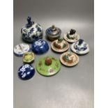Eleven Chinese or Japanese porcelain or cloisonne enamel covers, tallest 11cm