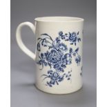 A Worcester cylindrical mug decorated in blue under glaze two large floral sprays, height
