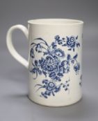 A Worcester cylindrical mug decorated in blue under glaze two large floral sprays, height