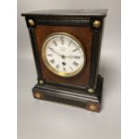 A French ebony and walnut mantel clock, height 25cm, 21cm at the base bears a Benson mark