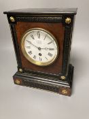 A French ebony and walnut mantel clock, height 25cm, 21cm at the base bears a Benson mark