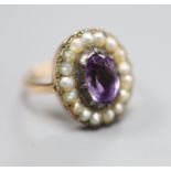 A 19th century, 9ct, amethyst and split pearl set oval cluster ring, size L, gross 5 grams.