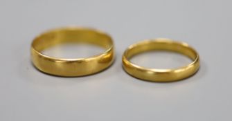 2 x 22ct gold wedding bands, gross 6.3 grams.
