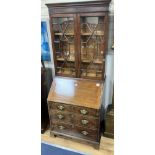 A small George III and later mahogany bureau bookcase, width 76cm, depth 50cm, height 192cm