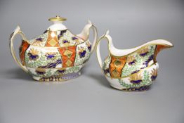 A Spode sucrier and cover painted in imari style with pattern 2213 and a matching 2213 cream