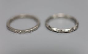 Two white metal and diamond chip set full eternity rings, one stamped platinum, size N, platinum