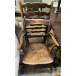 A 19th century ash and beech ladderback elbow chair and a spindle back elbow chair (2)
