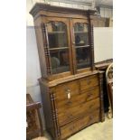 A 19th century Continental oak glazed cabinet on chest, width 104cm, depth 51cm, height 200cm