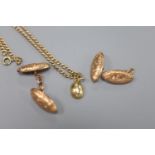 A pair of 9ct oval engraved gold cufflinks (one a.f.), a small 9ct gold bean pendant and a 9ct