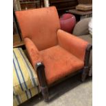 A George IV carved mahogany library armchair upholstered in faded red leather, width 70cm, depth