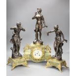 A French onyx and spelter figural clock garniture after Ferrand, plaques read Improvisateur