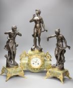 A French onyx and spelter figural clock garniture after Ferrand, plaques read Improvisateur