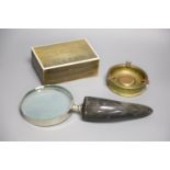 A horn veneered cigarette box, a horn handled magnifying glass and a Trench art ashtray