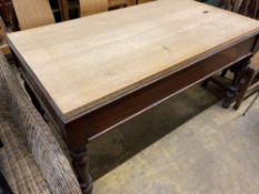 A Victorian mahogany rectangular kitchen table with associated beech top, length 150cm, depth