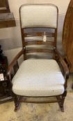 An Edwardian satinwood banded mahogany rocking chair