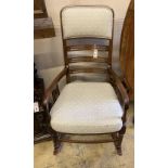 An Edwardian satinwood banded mahogany rocking chair