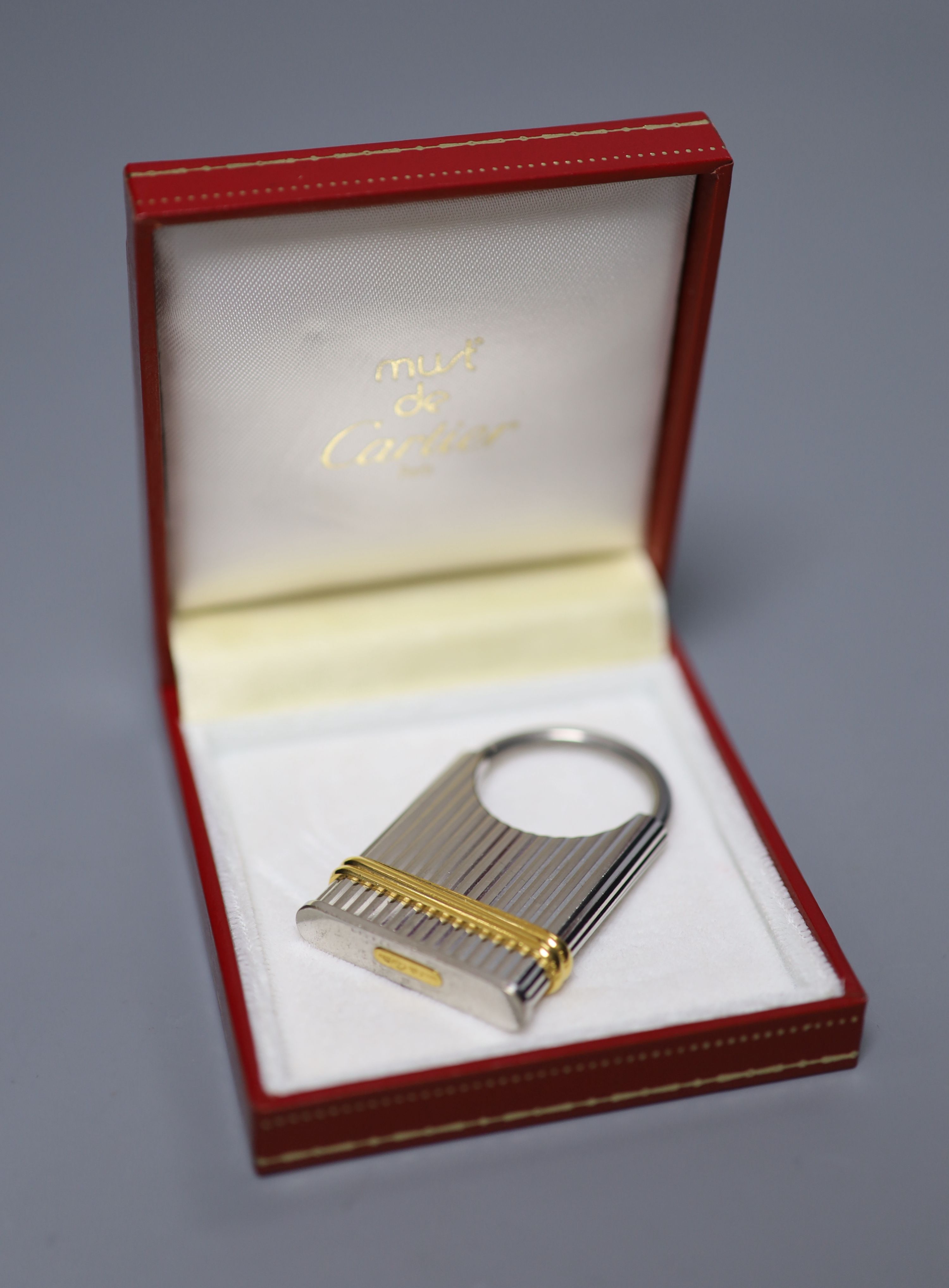 A steel and yellow metal Must de Cartier key fob, 52mm, with Cartier box.CONDITION: Numerous minor - Image 2 of 3