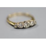 An 18ct and plat, graduated five stone diamond set half hoop ring, size N, gross 2.2 grams.