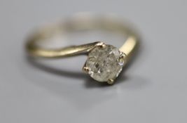 A modern 18ct gold set solitaire diamond ring, size S/T, gross 3.2 grams, the stone weighing