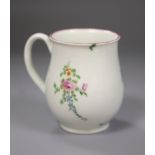 A Worcester bell shape mug painted with scattered coloured flowers, height 9cm