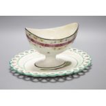 A 19th century creamware sugar bowl and a similar Wilson oval stand, longest 26cmCONDITION: Pedestal