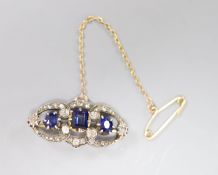 A Victorian synthetic?sapphire and diamond openwork bar brooch, silver setting, 27mm, gross 3.7g.