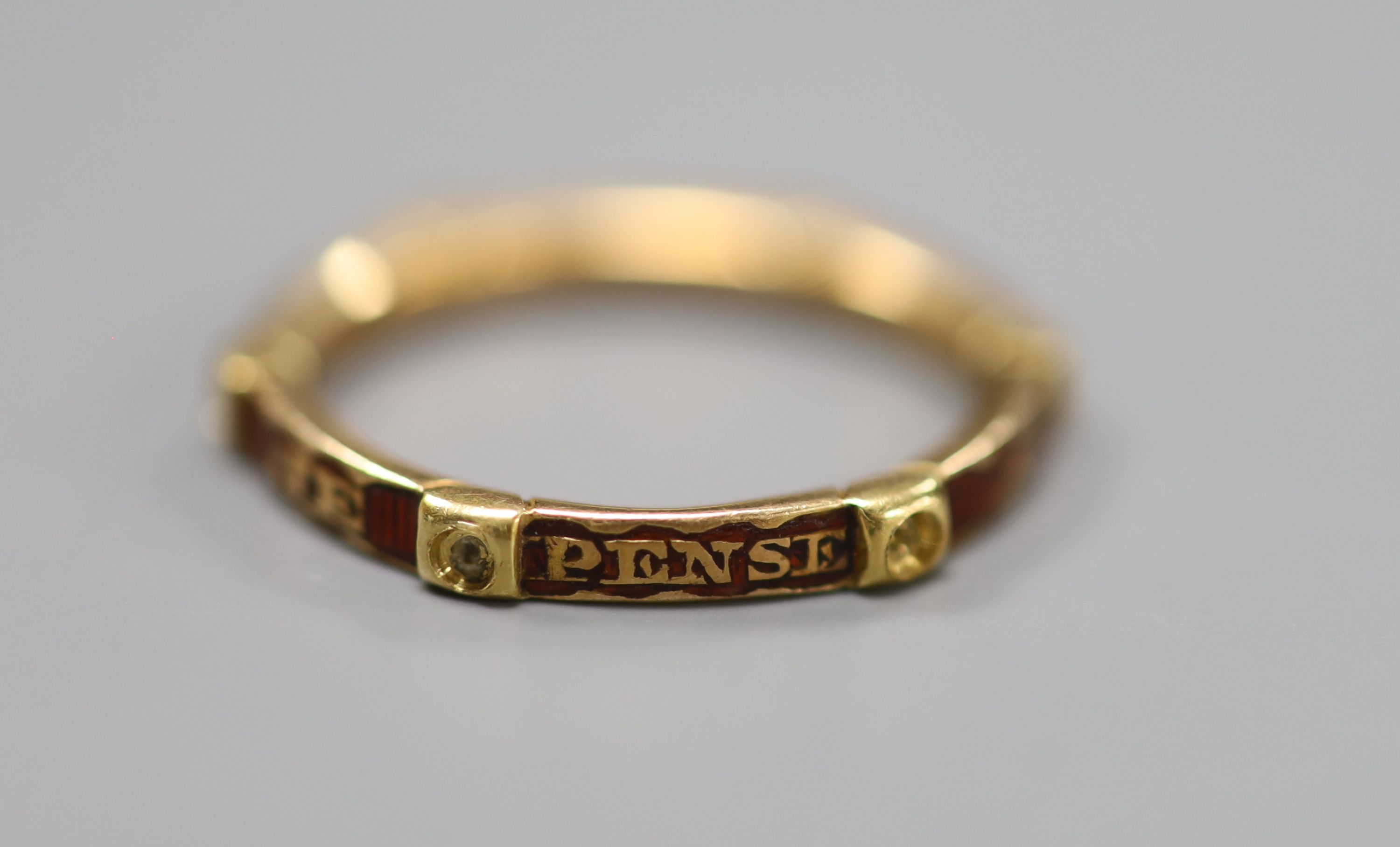 A French yellow metal and red enamel hexagonal band, inscribed 'Je Pense a Vous Tou Jours', (pearls?