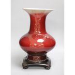 A 19th century Chinese sang de boeuf vase of squat baluster form with everted rim (a.f.), on