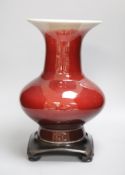 A 19th century Chinese sang de boeuf vase of squat baluster form with everted rim (a.f.), on
