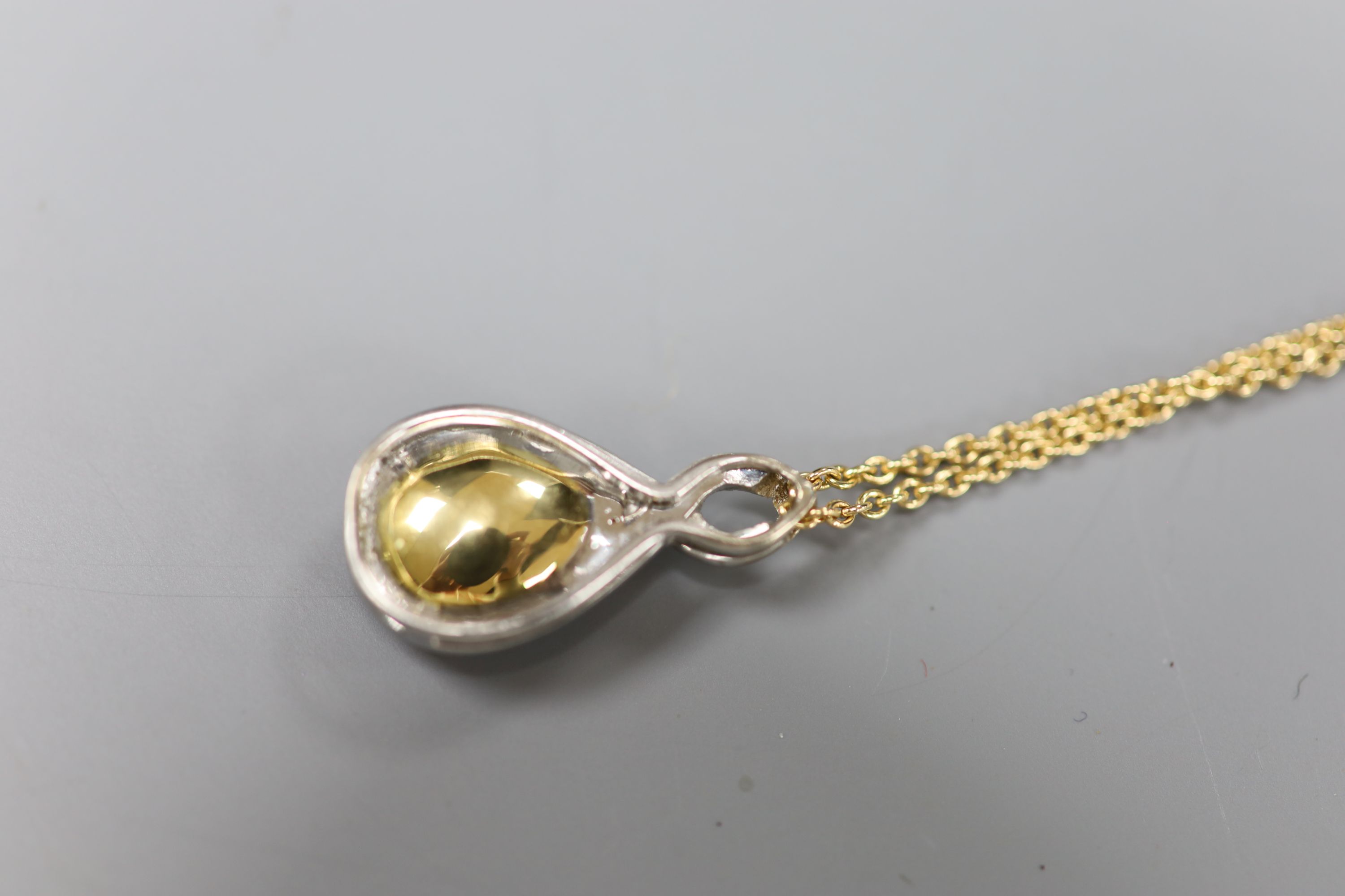 A white and yellow metal, garnet and diamond set teardrop shaped pendant necklace, pendant 29mm, - Image 4 of 4