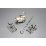 A George III silver meat skewer, Smith & Fearn, London, 1793, a silver sauce boat and a pair of