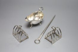 A George III silver meat skewer, Smith & Fearn, London, 1793, a silver sauce boat and a pair of