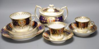 An early 19th century Chamberlains Worcester imari-style graduated set of three cups and saucers,