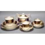 An early 19th century Chamberlains Worcester imari-style graduated set of three cups and saucers,