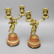 A pair of French ormolu 'cherub' two branch candelabra, height 27.5cm