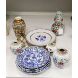 A collection of mixed Asian ceramics, including various Chinese blue and white export plates, a
