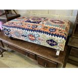 A Victorian style rectangular Kilim upholstered footstool, length 110cm, width 65cm, height 37cm